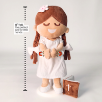 BibleGirl is the adorable plush girl doll that speaks 36 Bible verses. Holds her Bible with magnets in her hands and in the Bible. Wholesome dress. Beautiful braids with bows and a flower in her hair. Perfect Baptismgift idea for Christian girls. From Jesusdoll.com.