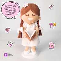 BibleGirl is the adorable plush girl doll that speaks 36 Bible verses. Holds her Bible with magnets in her hands and in the Bible. Wholesome dress. Beautiful braids with bows and a flower in her hair. Perfect Christmas gift idea for Christian girls. From Jesusdoll.com.