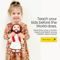 Child holding The Talking Jesus Doll. Teach your kids before the World does. From Jesusdoll.com.