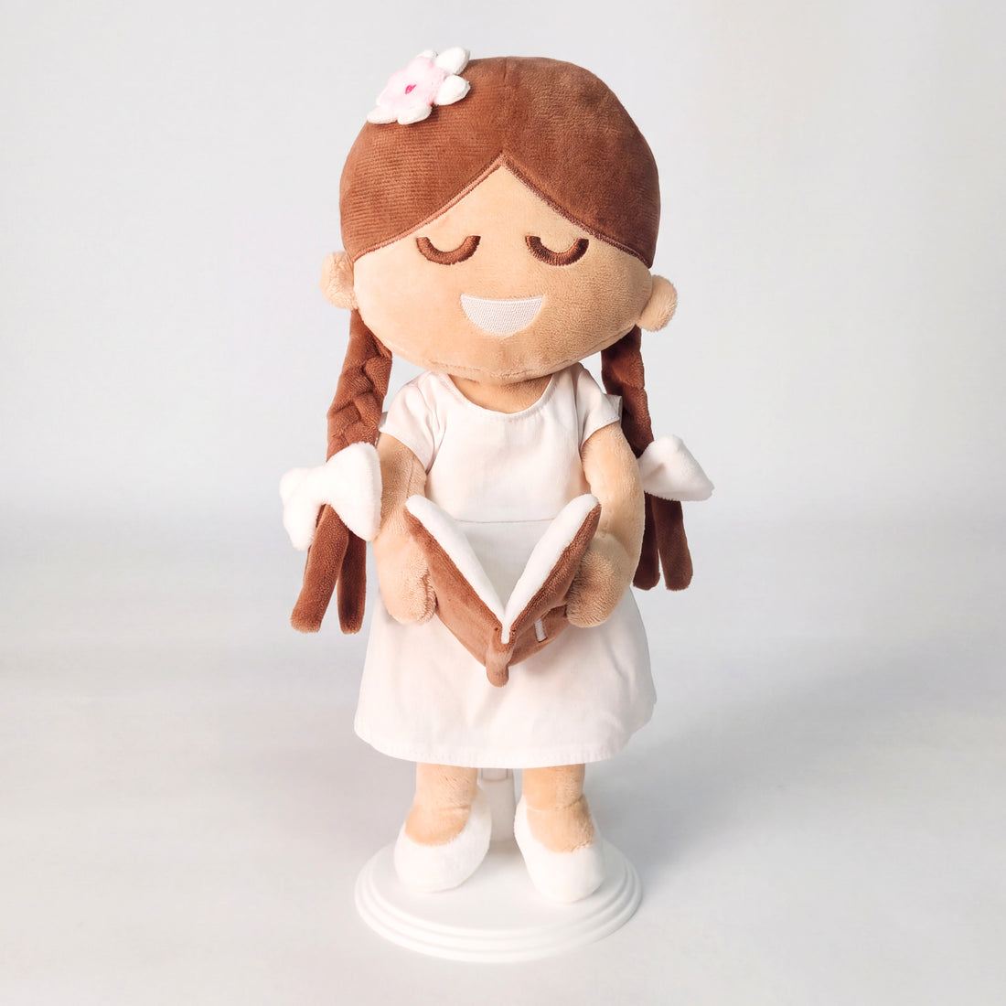BibleGirl is the adorable plush girl doll that speaks 36 Bible verses.  Holds her Bible with magnets in her hands and in the Bible.  Wholesome dress.  Beautiful braids with bows and a flower in her hair.  Perfect gift idea for Christian girls.  From Jesusdoll.com.