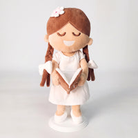 BibleGirl is the adorable plush girl doll that speaks 36 Bible verses.  Holds her Bible with magnets in her hands and in the Bible.  Wholesome dress.  Beautiful braids with bows and a flower in her hair.  Perfect gift idea for Christian girls.  From Jesusdoll.com.