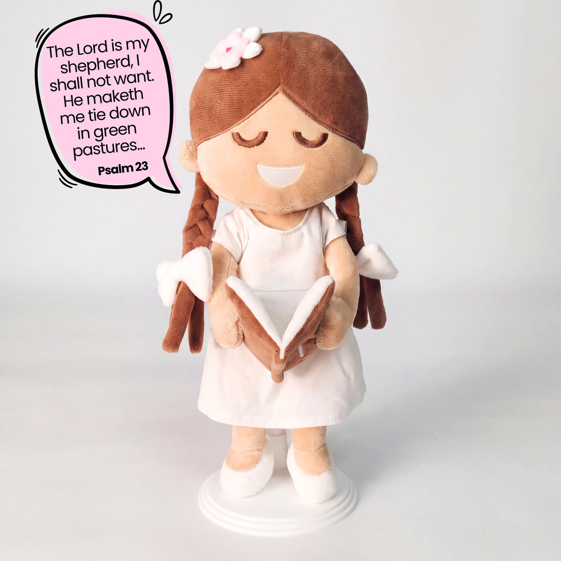 BibleGirl is the adorable plush girl doll that speaks 36 Bible verses.  Holds her Bible with magnets in her hands and in the Bible.  Wholesome dress.  Beautiful braids with bows and a flower in her hair.  Perfect Christmas  gift idea for Christian girls.  From Jesusdoll.com.